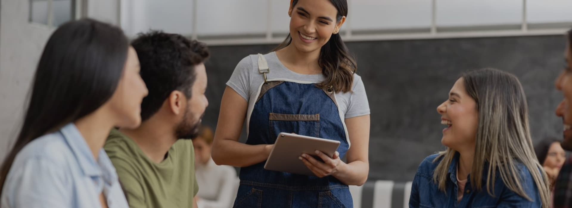 a server taking orders with a handheld pos