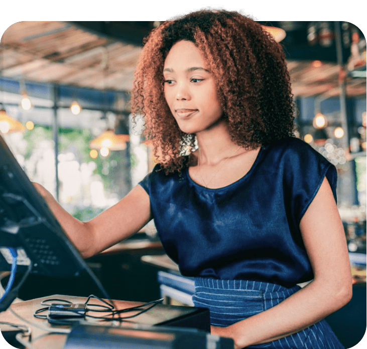young african waitress using pos point of sale terminal to put in order