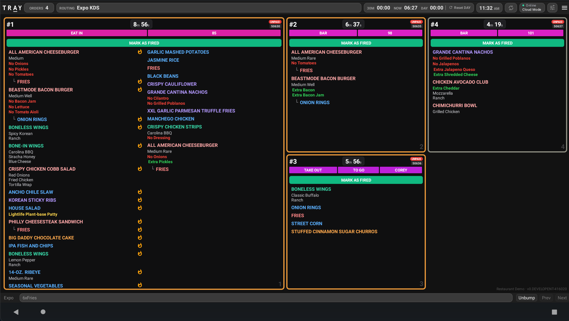 TRAY Modern KDS dark mode showing active kitchen orders in Expo KDS routing
